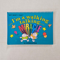 Book with colourful cover featuring cartoon characters and text on a textured gray background