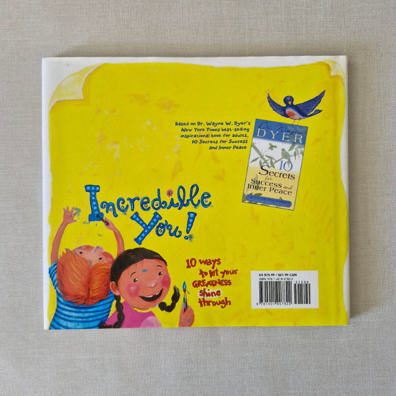 Back cover of a children's book with a yellow background and illustrations of children playing.