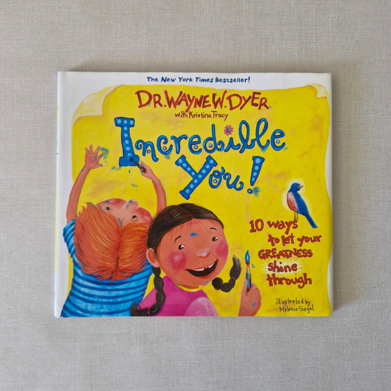 Children's book titled 'Incredible You!' by Dr. Seuss on a textured surface