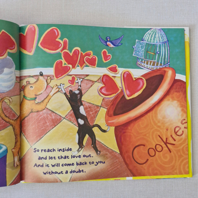 Colourful book cover with a cat, dog, and cookie jar illustration on a white background
