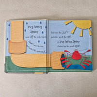 Children's book with colourful illustrations of a spider and sun on a beige background