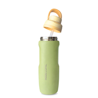 Green water bottle with a yellow lid on a white background