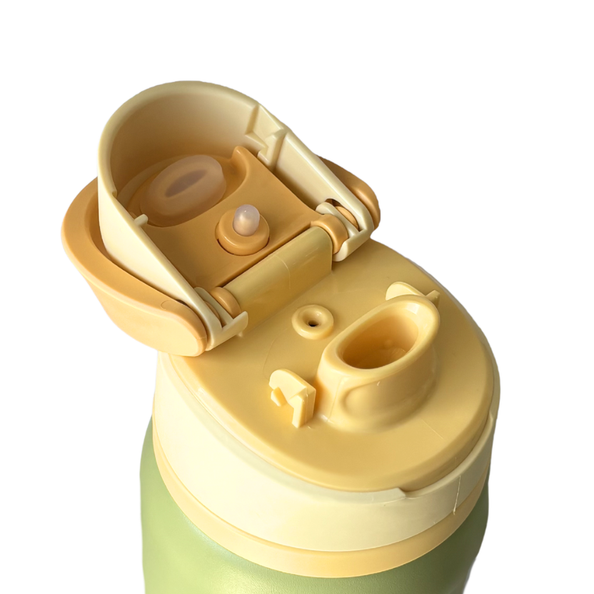 Green and yellow water bottle with a unique design on a white background