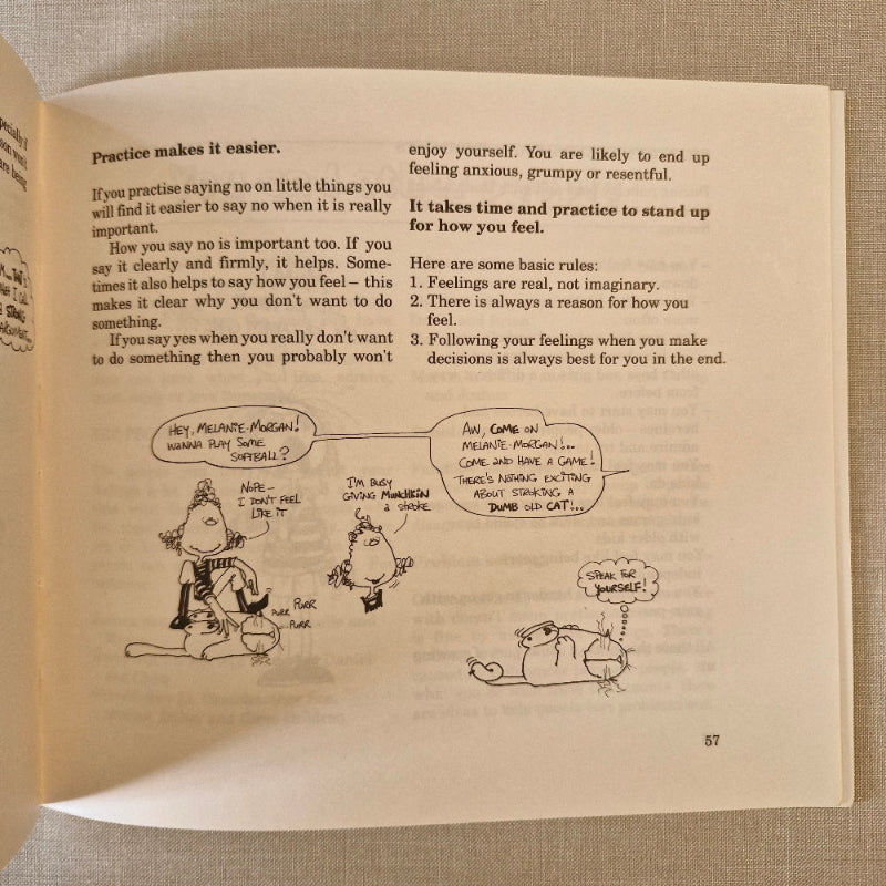 Open book with cartoon illustrations of a person and a cat on a textured fabric background