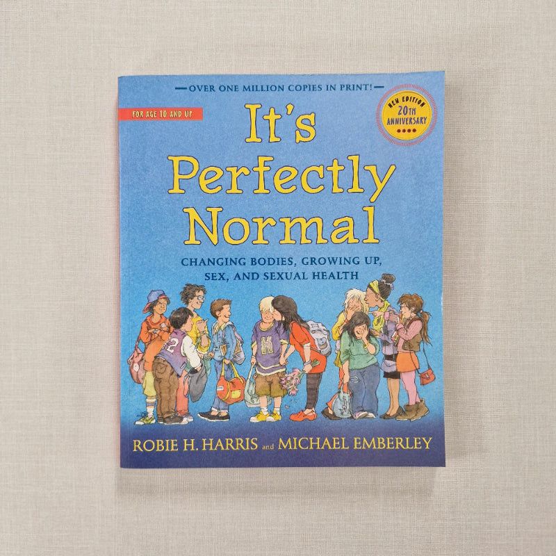 Book titled 'It's Perfectly Normal' on a beige background