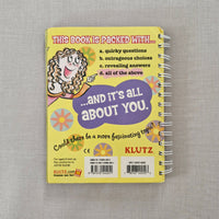 Colourful back book cover and text on a gray background