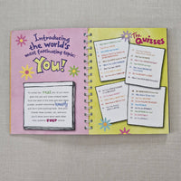 Book page with quiz cards on a textured surface