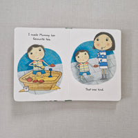 Illustrated book with two circular illustrations of a child and an adult on a gray fabric background.