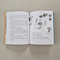 Open book with illustrations and text on a textured surface