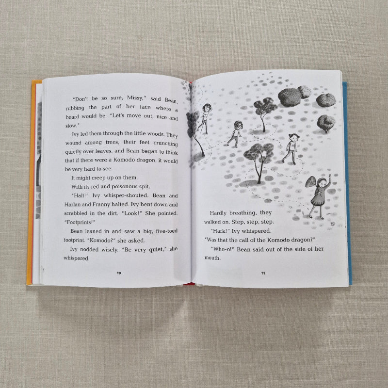 Open book with illustrations and text on a textured surface