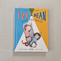 Book cover of 'Ivy and Bean Make the Rules' on a textured surface