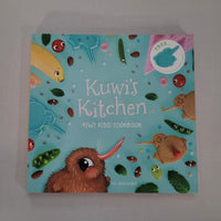Children's cookbook titled 'Kuwi's Kitchen' with colourful illustrations on a blue background.
