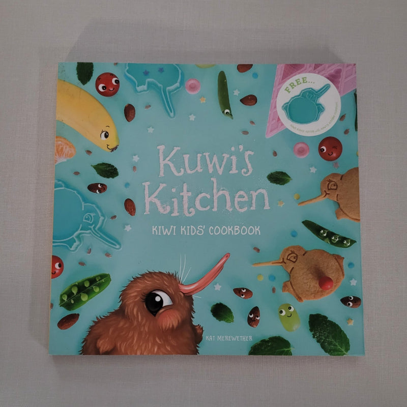 Children's cookbook titled 'Kuwi's Kitchen' with colourful illustrations on a blue background.