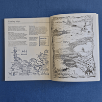Open book with detailed maps on a blue background