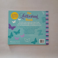 Book titled 'The Lettering Book' with butterfly illustrations on a beige background