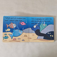 Children's book with illustrations of fish on a beige background
