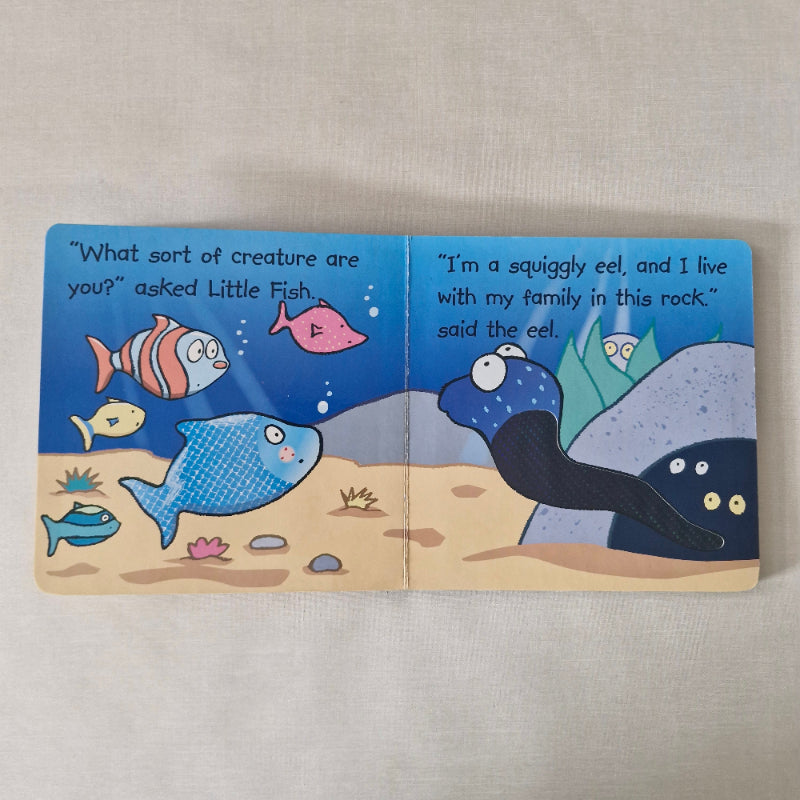 Children's book with illustrations of fish on a beige background