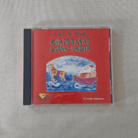 CD cover of 'Love to Sing Christmas Down Under' by Linda Adamson on a textured gray surface