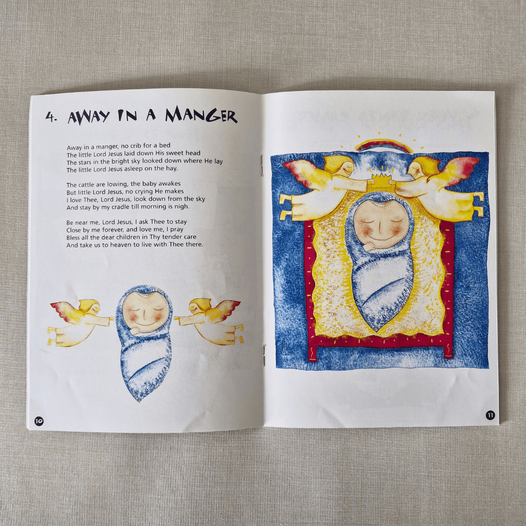 Open book with Christmas-themed illustration and text on a textured surface