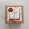 Macrame kit packaging with a decorative label on a light grey background