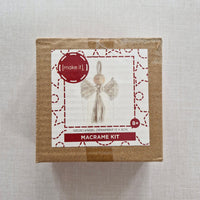 Macrame kit packaging with a decorative label on a light grey background