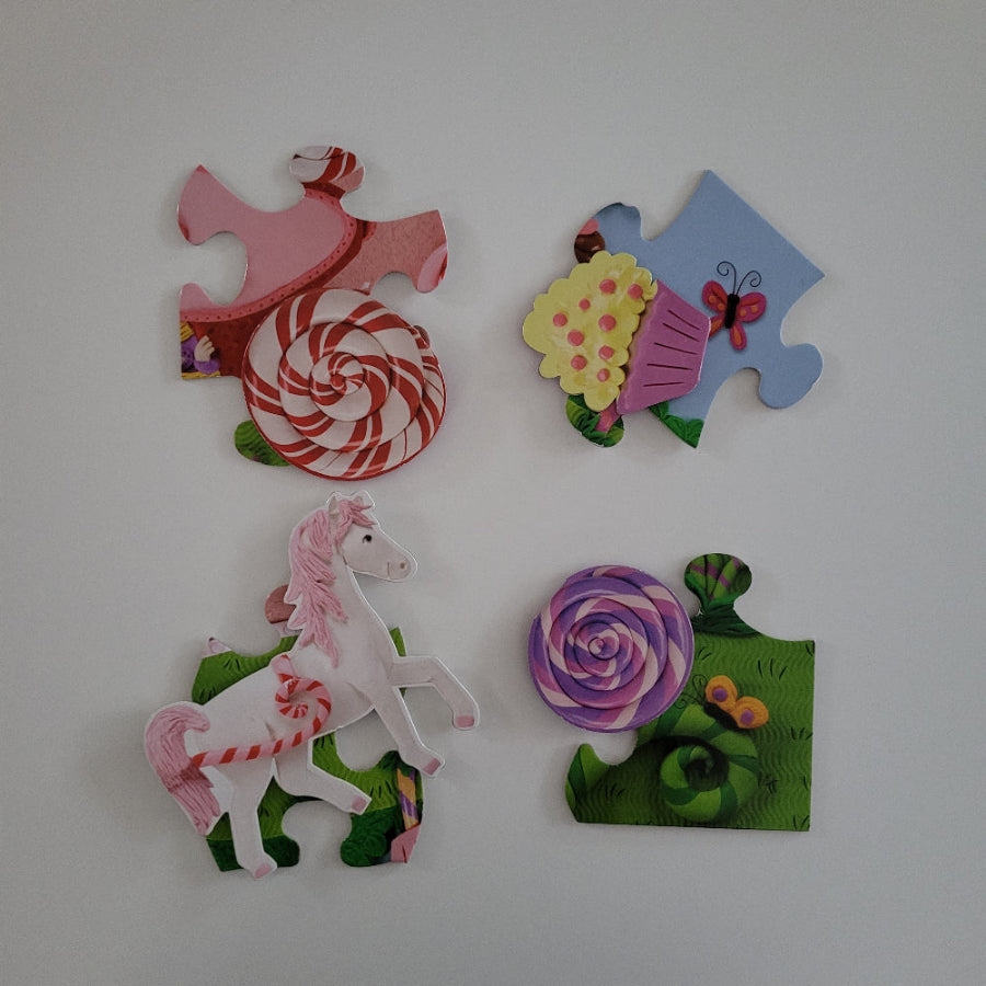 Colourful puzzle pieces with floral and candy designs on a white background