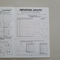 Page in book with measurement-related diagrams and text on a gray background