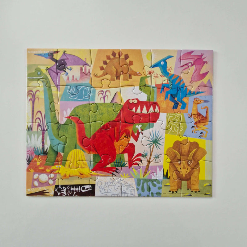 Children's dinosaur puzzle on a plain background