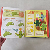 Open book with craft instructions for making a cactus-shaped toy on a textured surface.