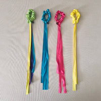 Colourful ribbons on a gray background