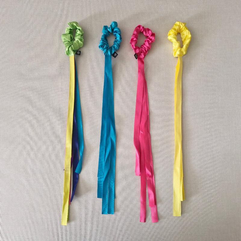 Colourful ribbons on a gray background