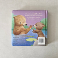 Back cover of a children's book with bear illustrations on a textured surface