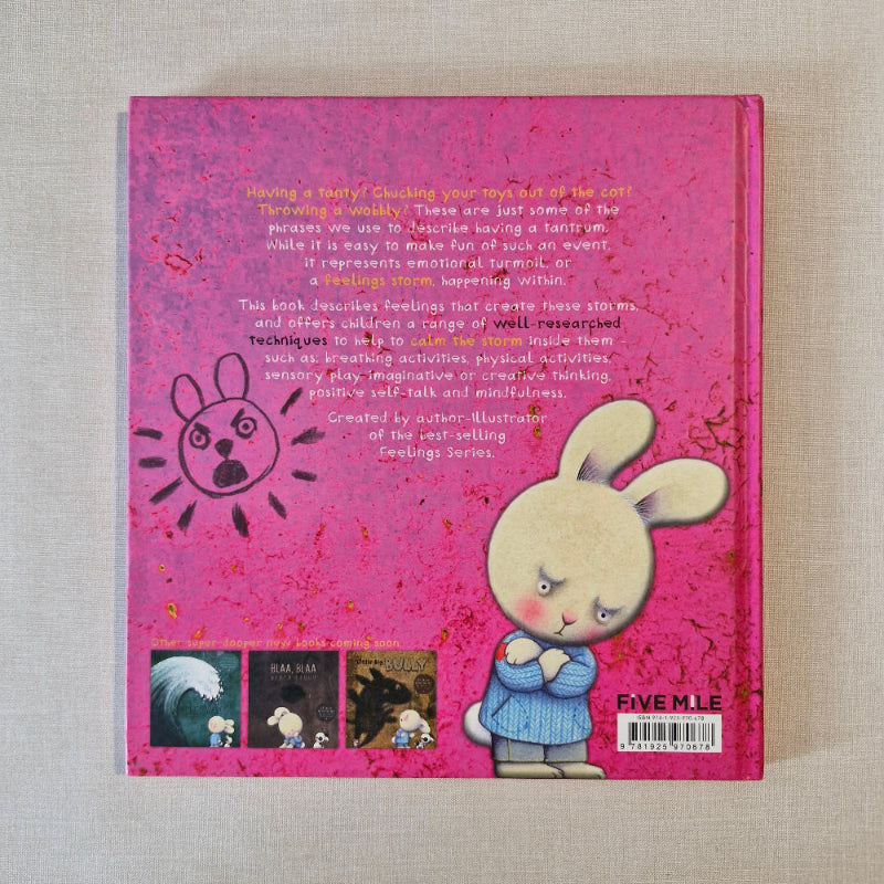 Pink book back cover with cartoon character and text on a textured surface