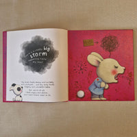 Open book with illustrations and text on a textured surface