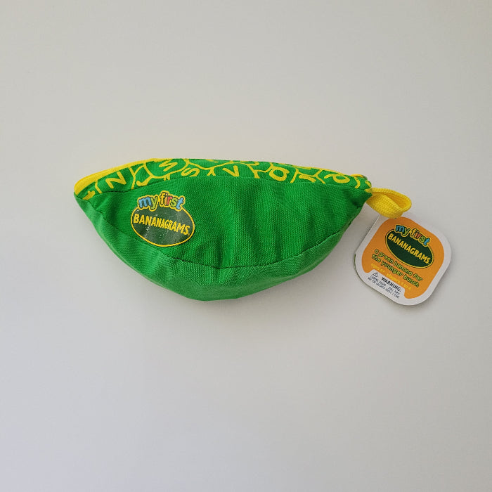 Green fabric bag with yellow accents on a white background