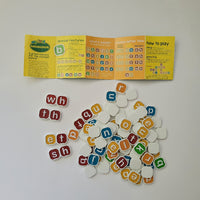 Alphabet tiles with colourful letters and a 'how to play' sheet on a white background