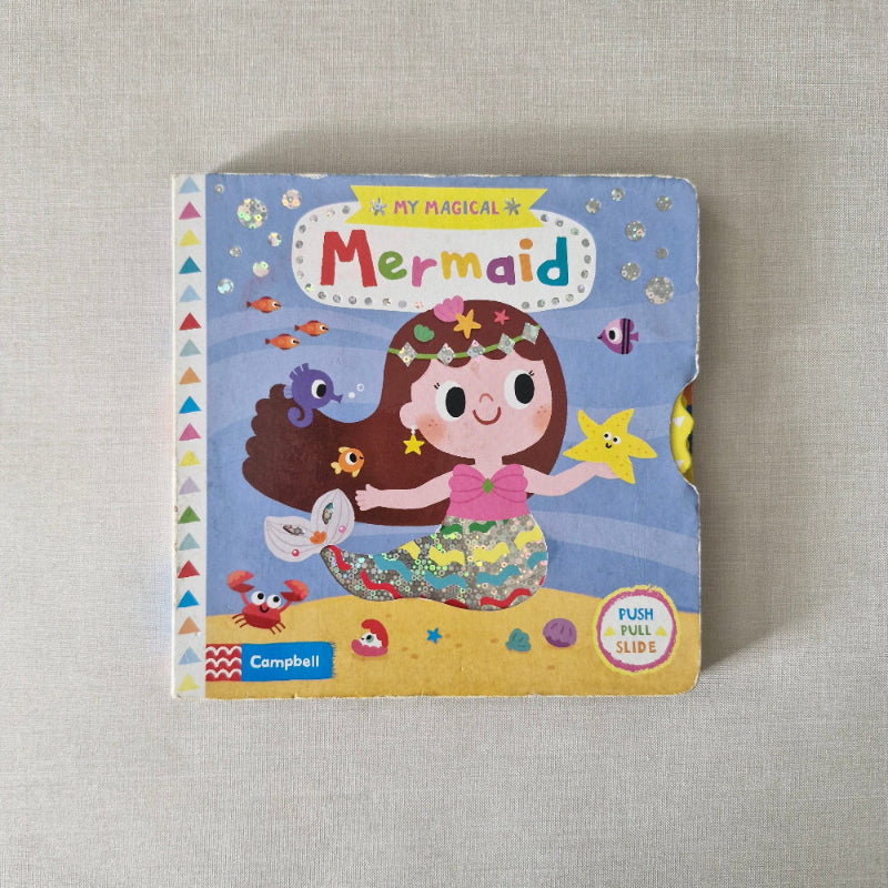 Children's book titled 'My Magical Mermaid' on a textured surface