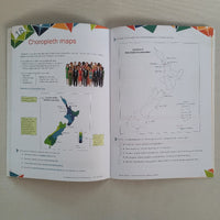 Open book with maps and text on a plain background