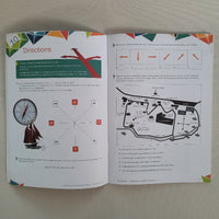 Open book with diagrams and text on a plain background