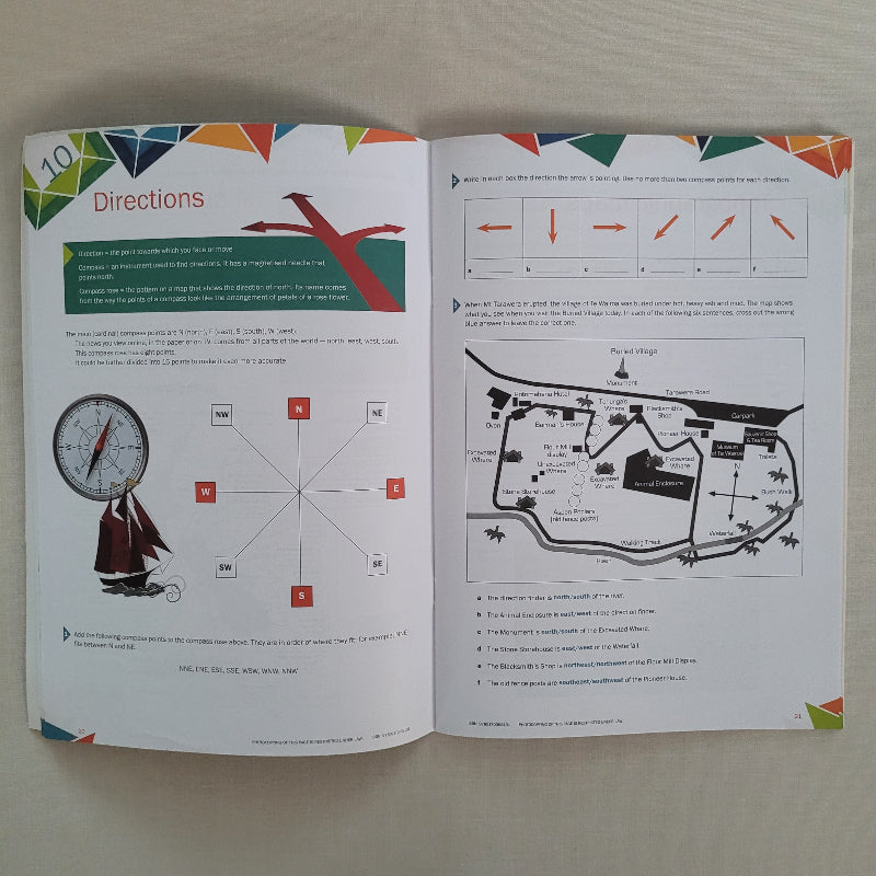 Open book with diagrams and text on a plain background