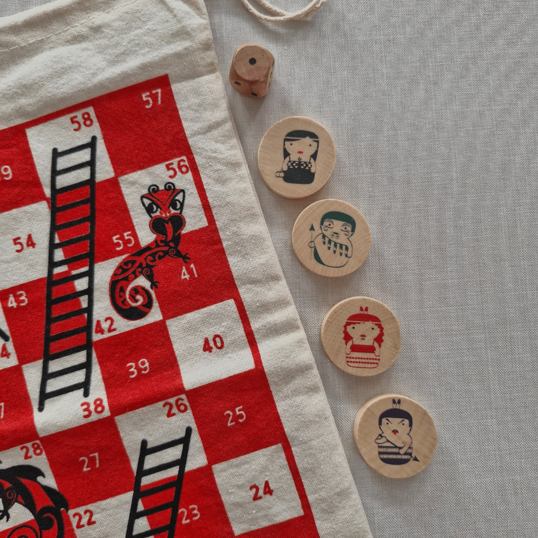 Board game pieces with a red and white board featuring numbers and black illustrations.