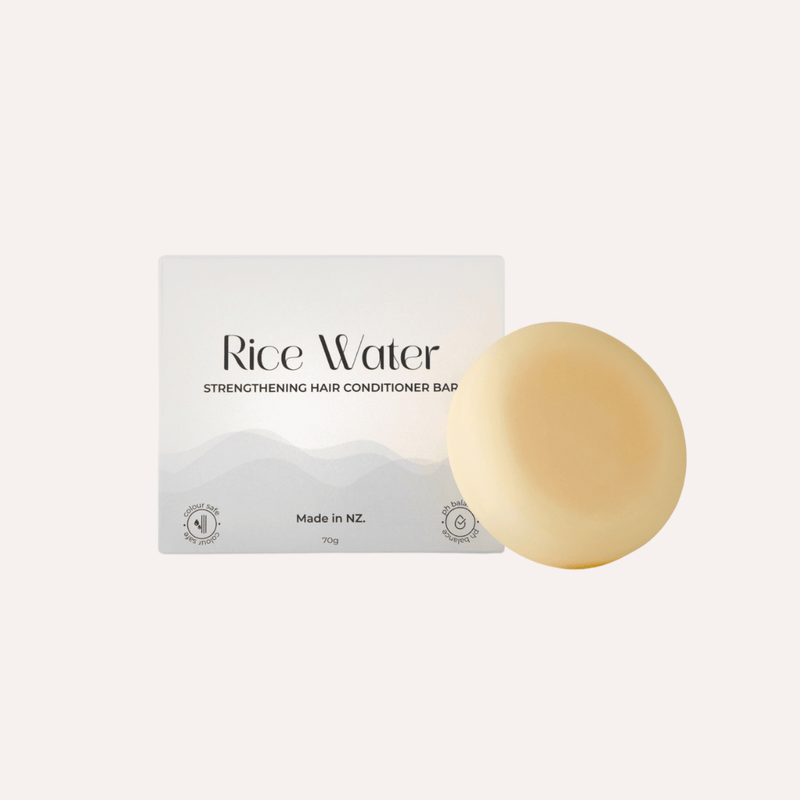 Rice Water strengthening hair conditioner bar with packaging on a white background