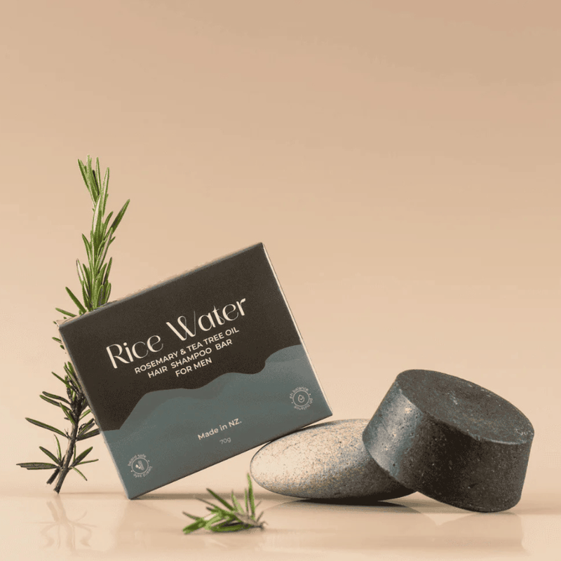 Rice Water hair shampoo bar for men with packaging and rosemary plant on a beige background