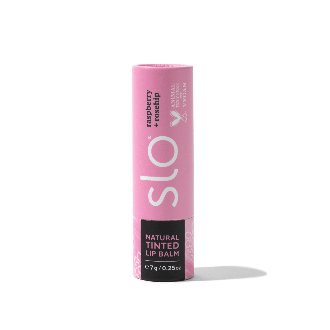 Pink lip balm tube with 'slo' branding on a white background