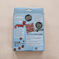 Game box packaging with text and graphics on a beige background