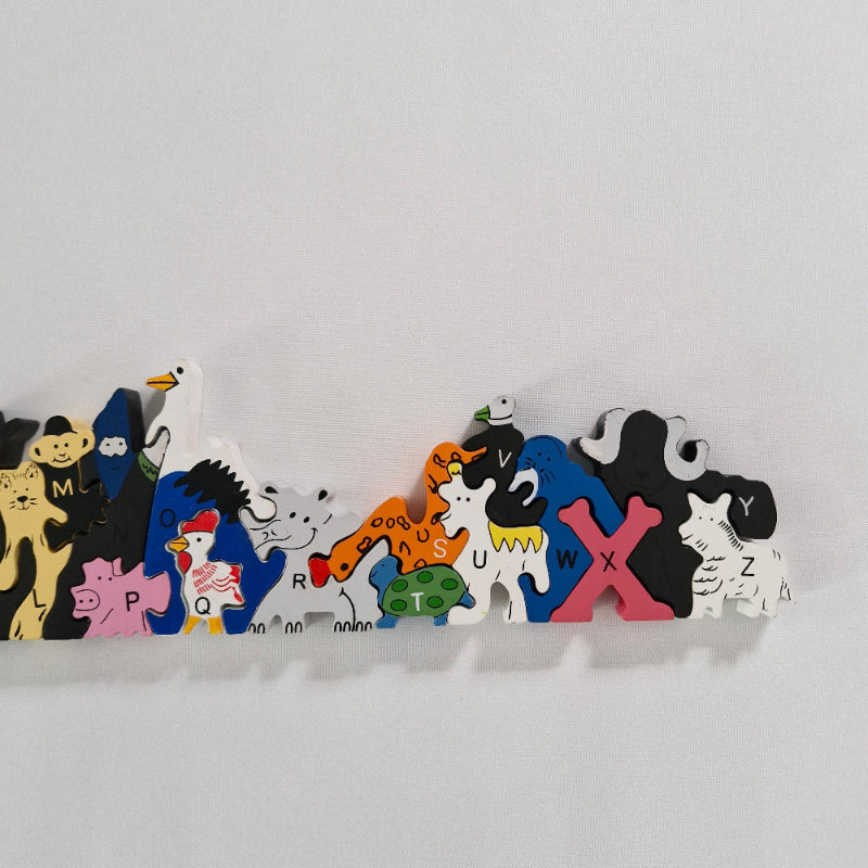 Colourful animal puzzle pieces on a white background