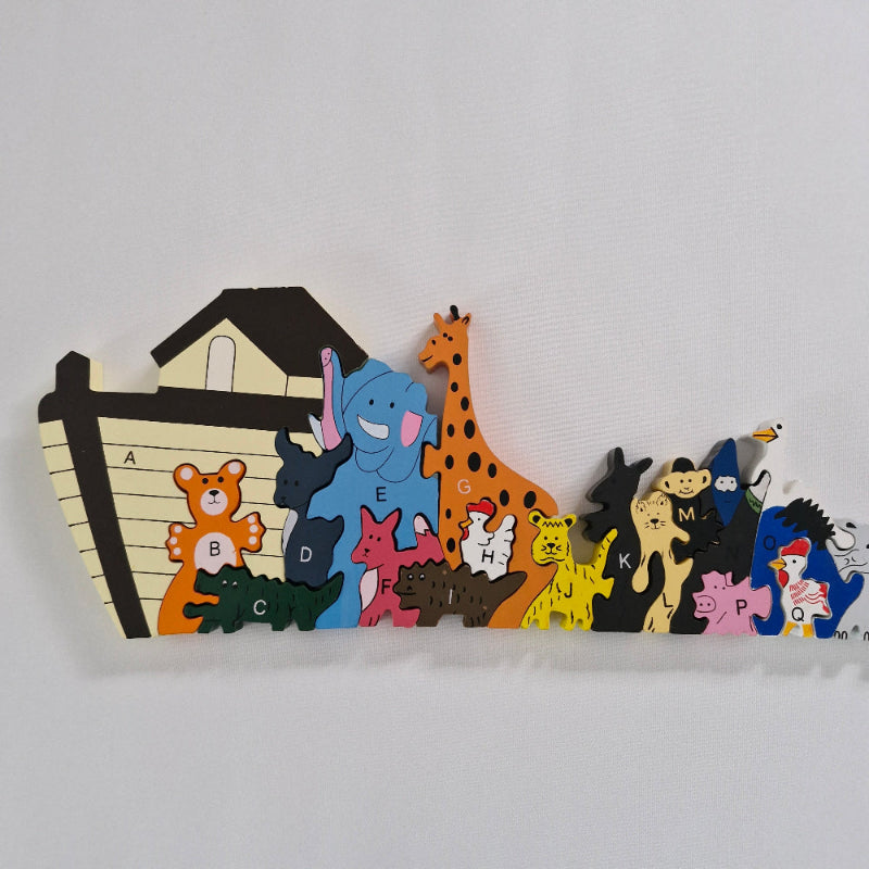 Wooden puzzle with animal-shapes on a white background