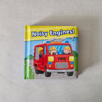 Children's book titled 'Noisy Engines!' with a fire engine illustration on a textured surface.