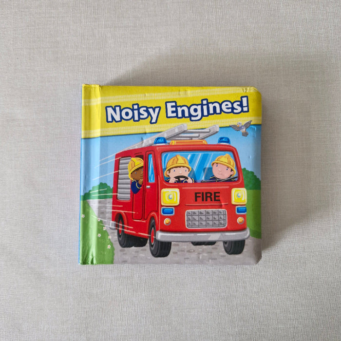 Children's book titled 'Noisy Engines!' with a fire engine illustration on a textured surface.