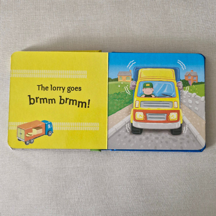 Children's book with a colourful illustration of a lorry on a textured surface